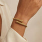 Armband i 18K guldpläterat stål – öppet format