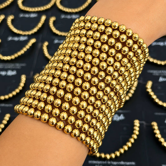 Kularmband i 18K guldpläterat stål – öppet format 8 cm